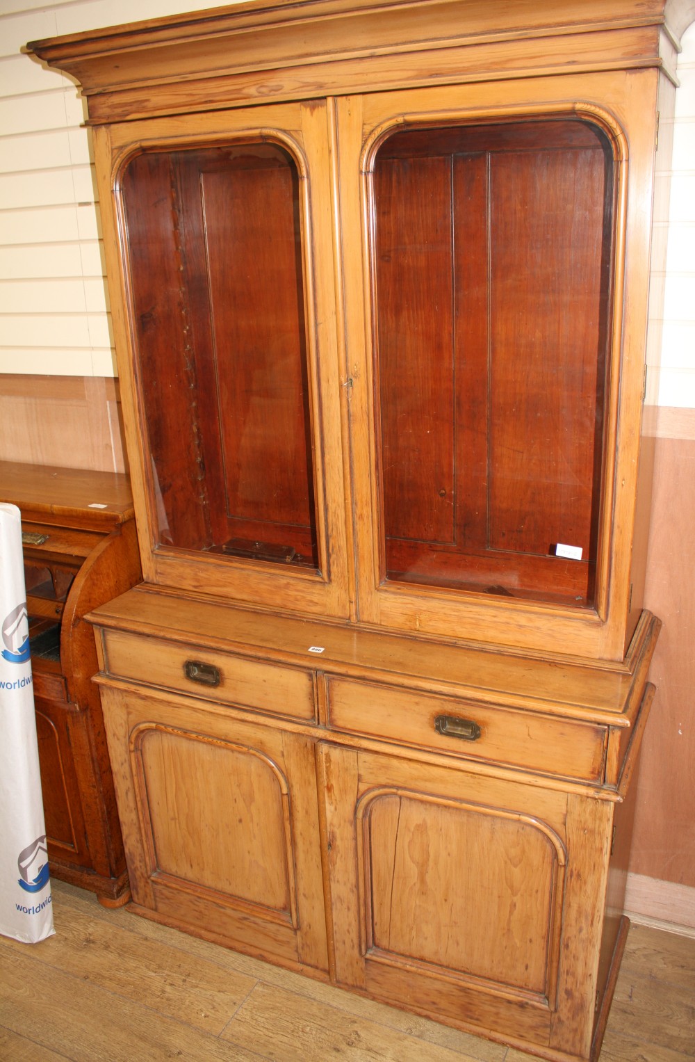 A Victorian pine bookcase, W.130cm D.50cm H.220cm